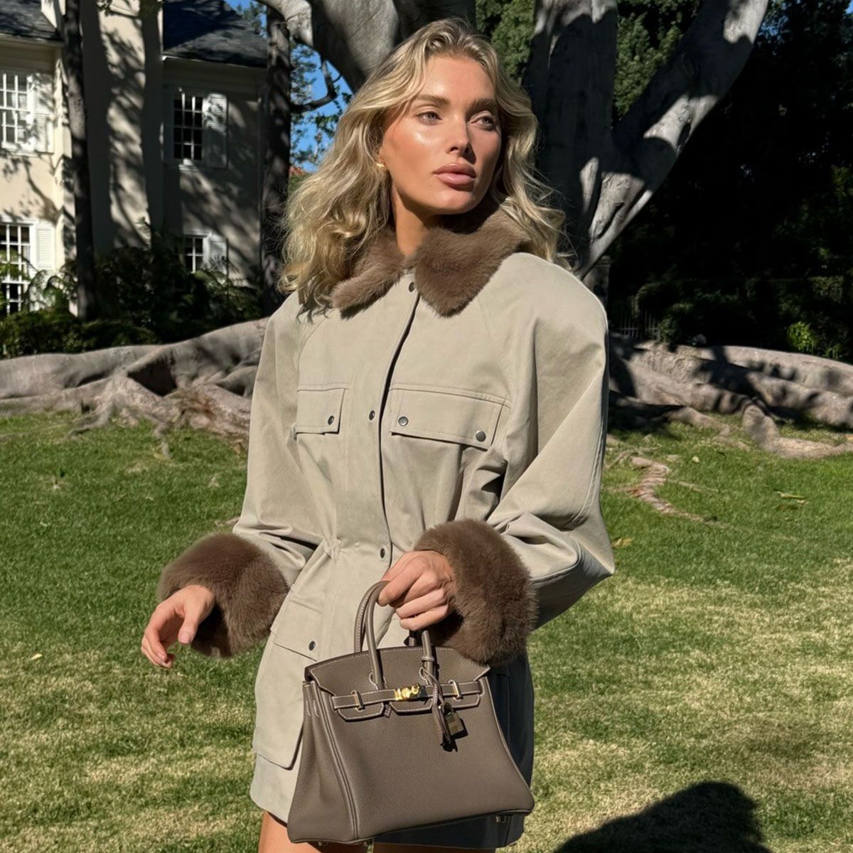 Woman in a faux-fur trim jacket