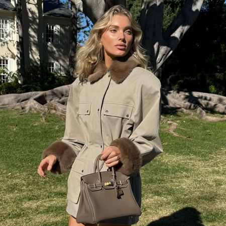 Woman in a faux-fur trim jacket