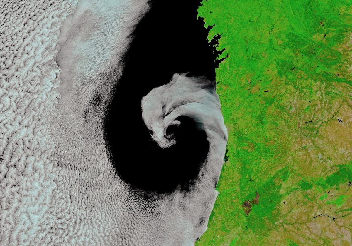 An instrument aboard NASA&#039;s Terra satellite captured this image of a curl of moist air licking the coast of Portugal on July 16, 2017.