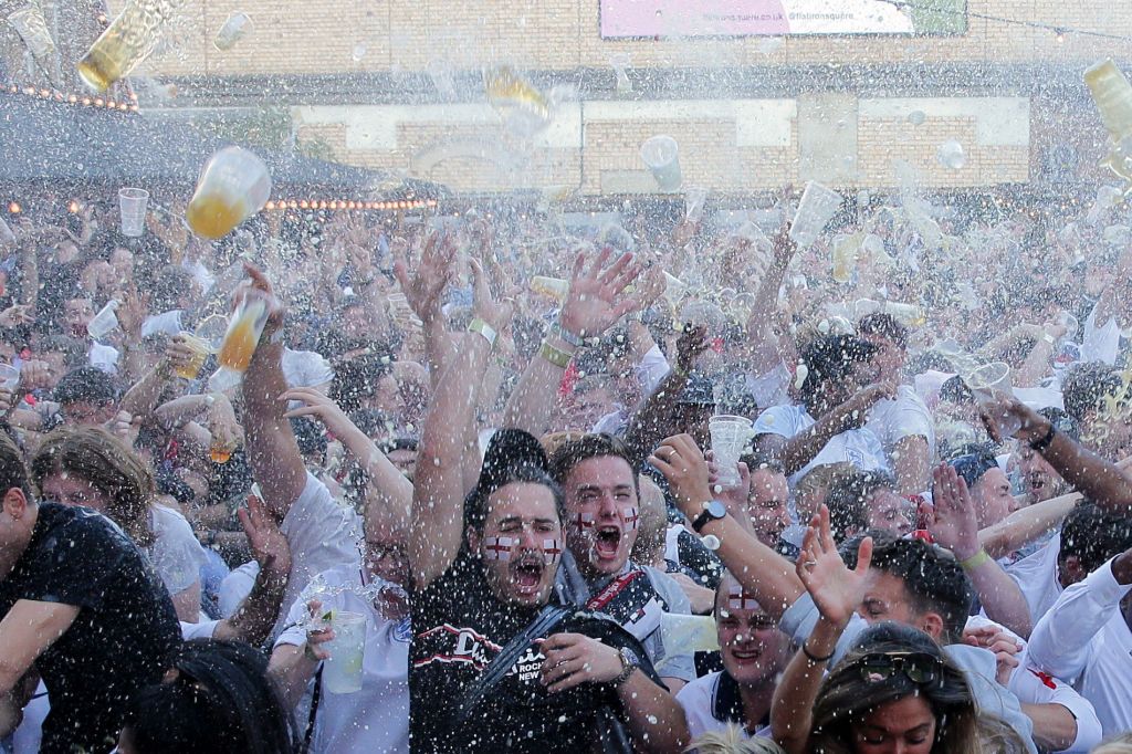 England supporters in Flat Iron Square in London react as they watch England score in the 2018 World Cup semi-final between England and Croatia in Moscow on July 11, 2018