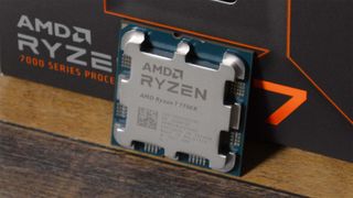 An AMD Ryzen 7 7700X with its retail packaging