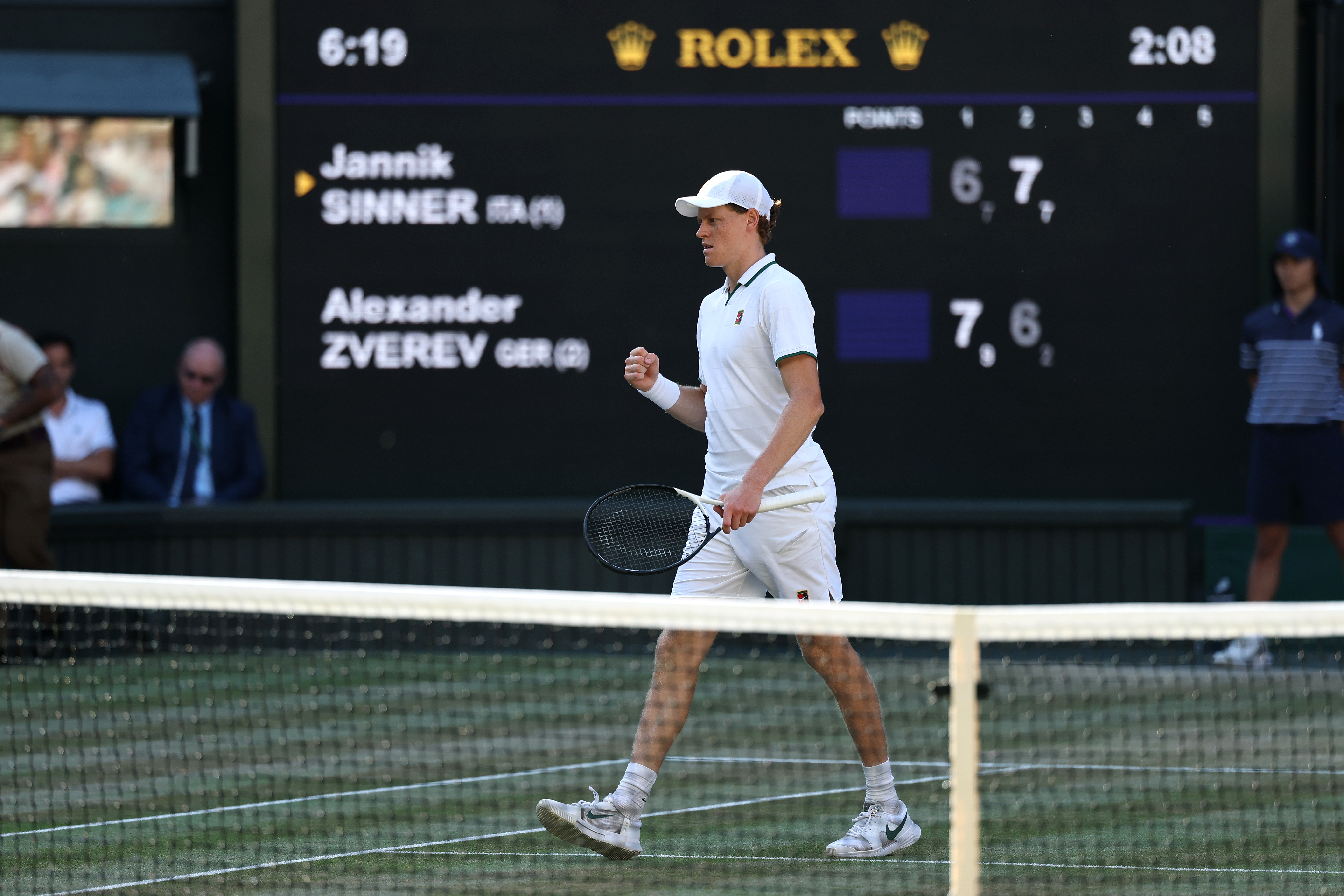 Jannik Sinner walks across Centre Court at Wimbledon 2026