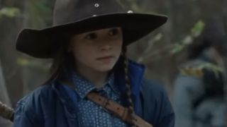 Close up of Cailey Fleming wearing a brown cowboy hat in The Walking Dead