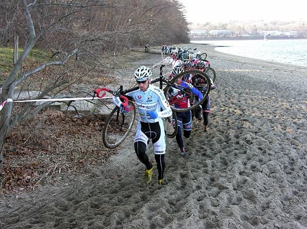 Adam Myerson on the beach during the second lap, still leading the elite men's race.