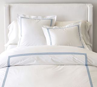 White bedding with blue edge details