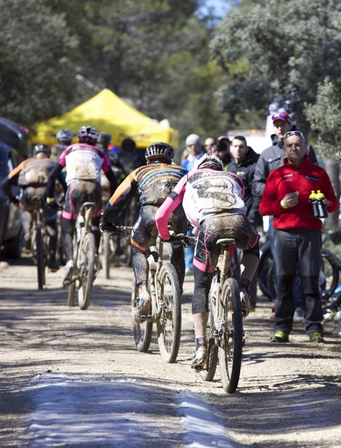 Riders roll through the feed zone.