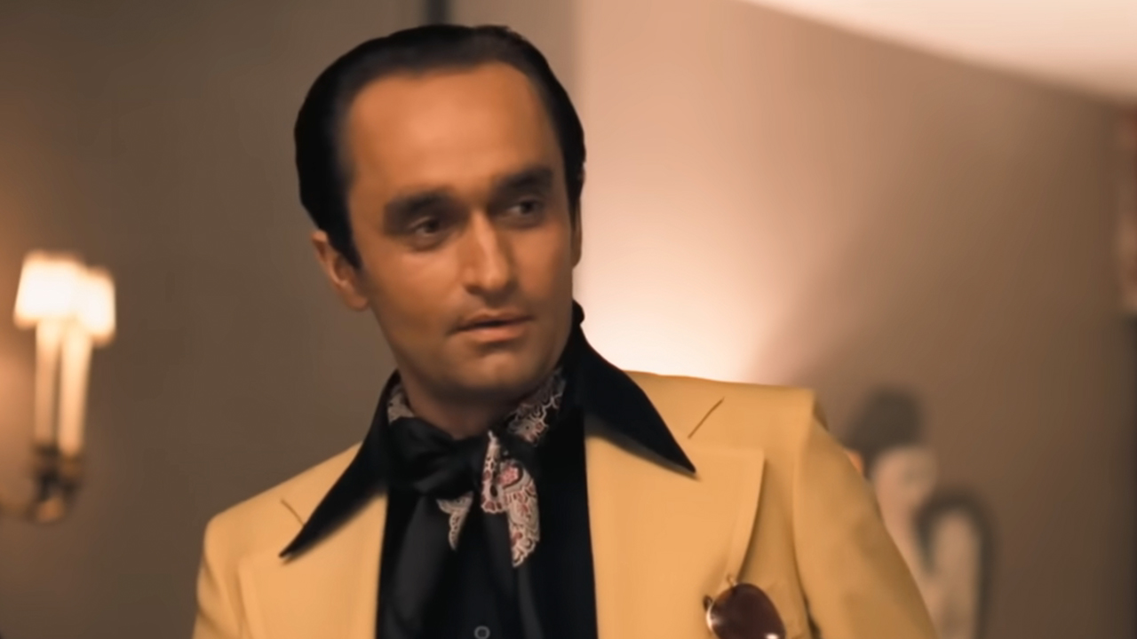 John Cazale looking to the left in a white jacket with black lapels in The Godfather