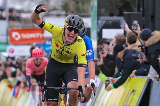 Team Visma-Lease a Bike's Dutch cyclist Olav Kooij celebrates as he crosses the finish line to win the 1st stage of the Paris-Nice cycling race, 158 km between Les Mureaux and Les Mureaux, on March 3, 2024. (Photo by Thomas SAMSON / AFP)