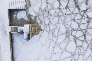 Norway bathing installations by rintala eggertsson view from above with frozen sea