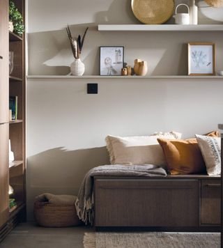 A kitchen reading nook bench with comfy brown and neutral cushions