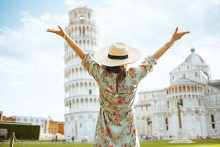Woman near Leaning Tower of Pisa, Italy