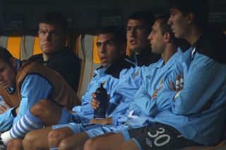 Carlos Tevez (third left) on the bench for Manchester City against Bayern Munich in the Champions League in September 2011.