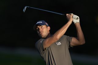 Ugo Coussaud hits an iron shot into the green