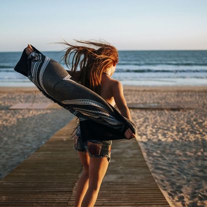 best sea salt sprays - Woman with long hair on the beach