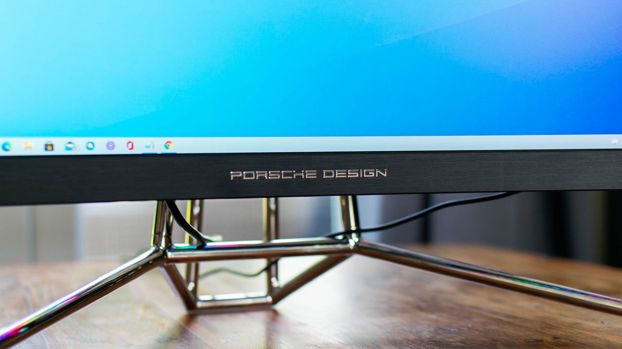 A closeup of the Porsche Design logo on the Porsche Design AOC Agon PD27