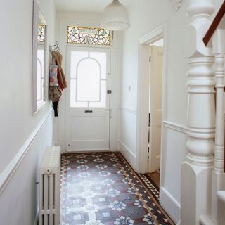 white coloured hallway with original victorian tiles