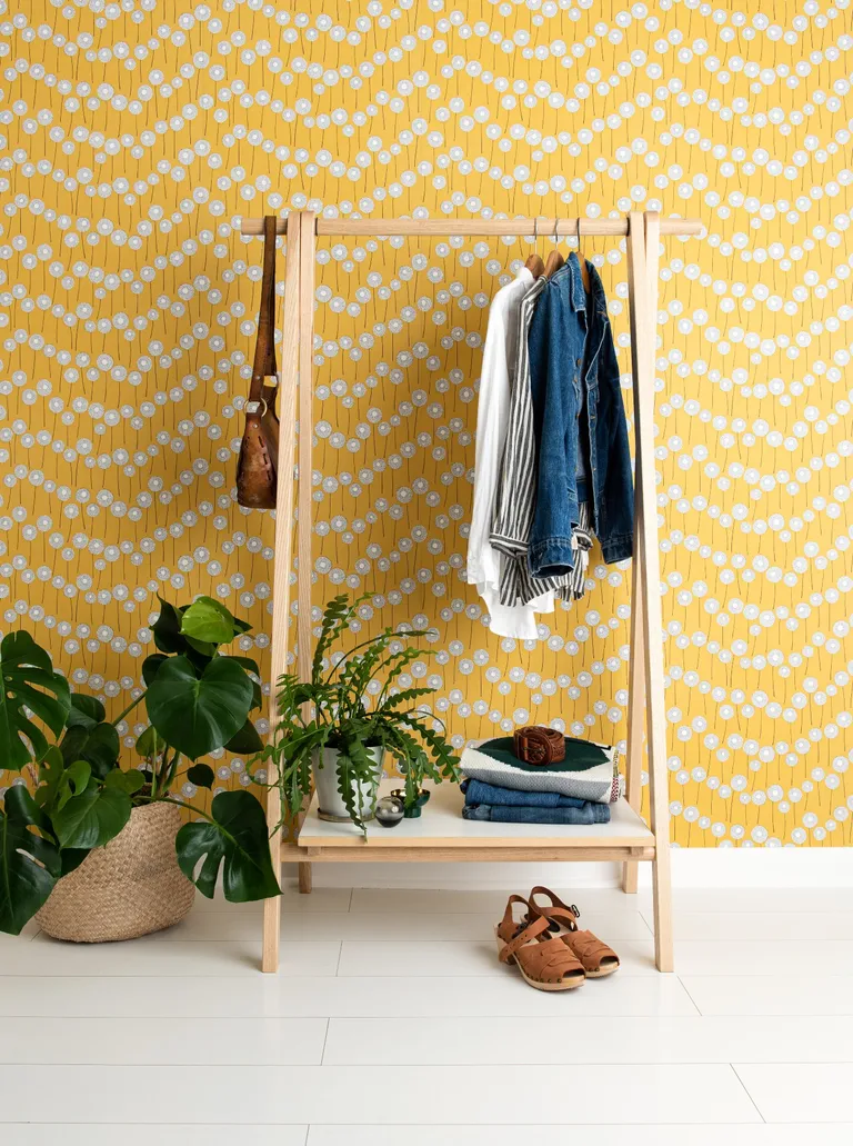 yellow wallpapered wall