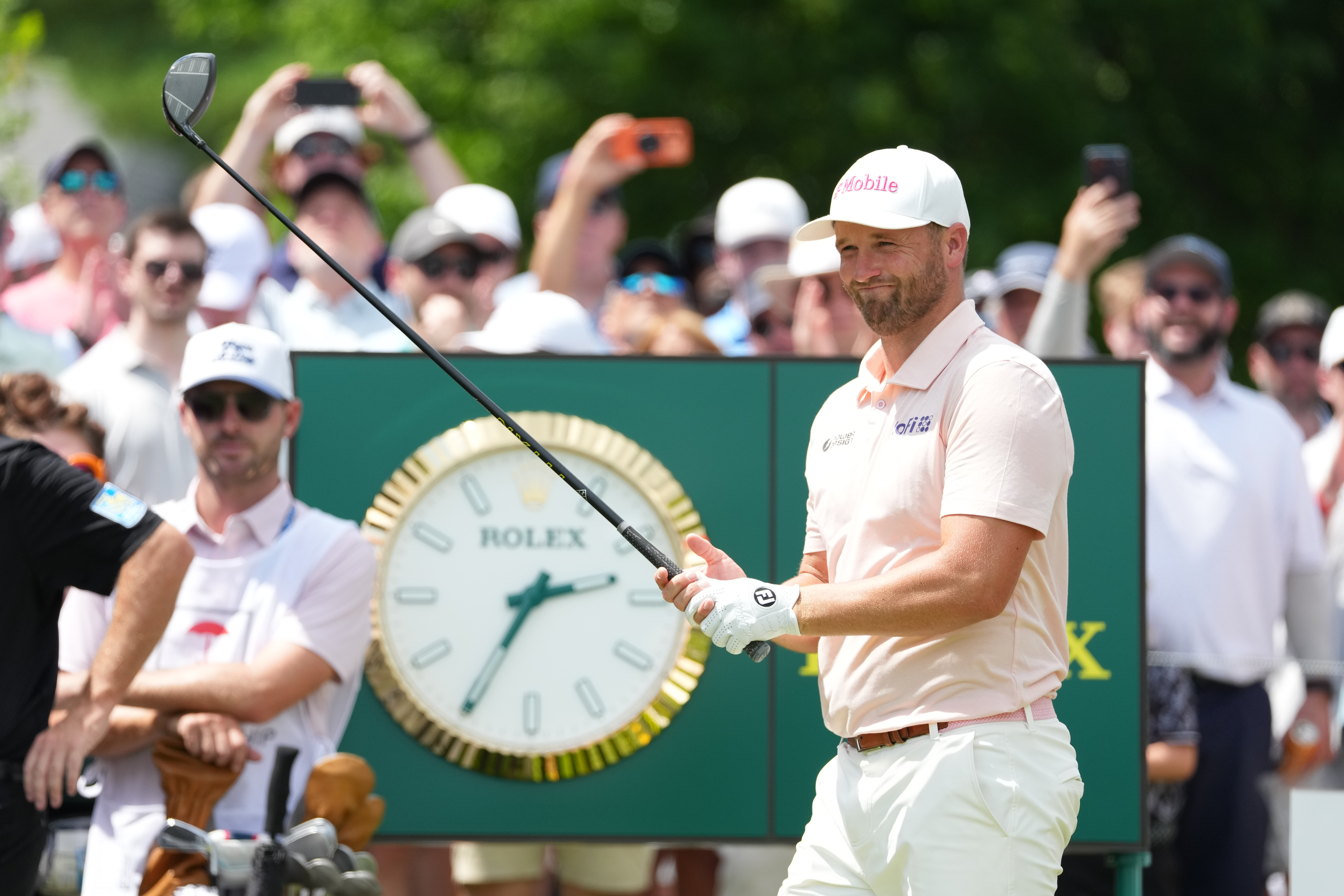 Wyndham Clark smiles while standing on the first tee box during the final round of the Travelers Championship