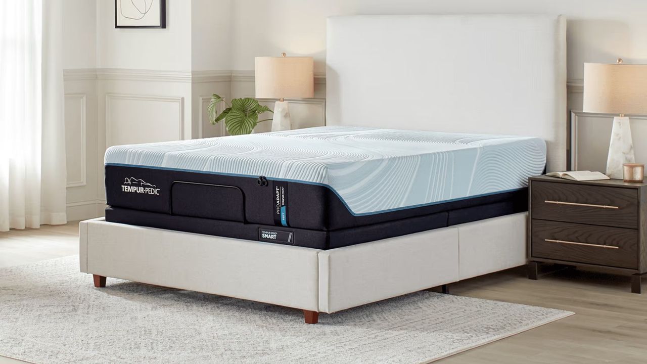 Tempur-Pedic ProAdapt Mattress on a white bed frame against a white wall.