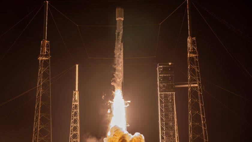 rocket launching from a launch pad at night