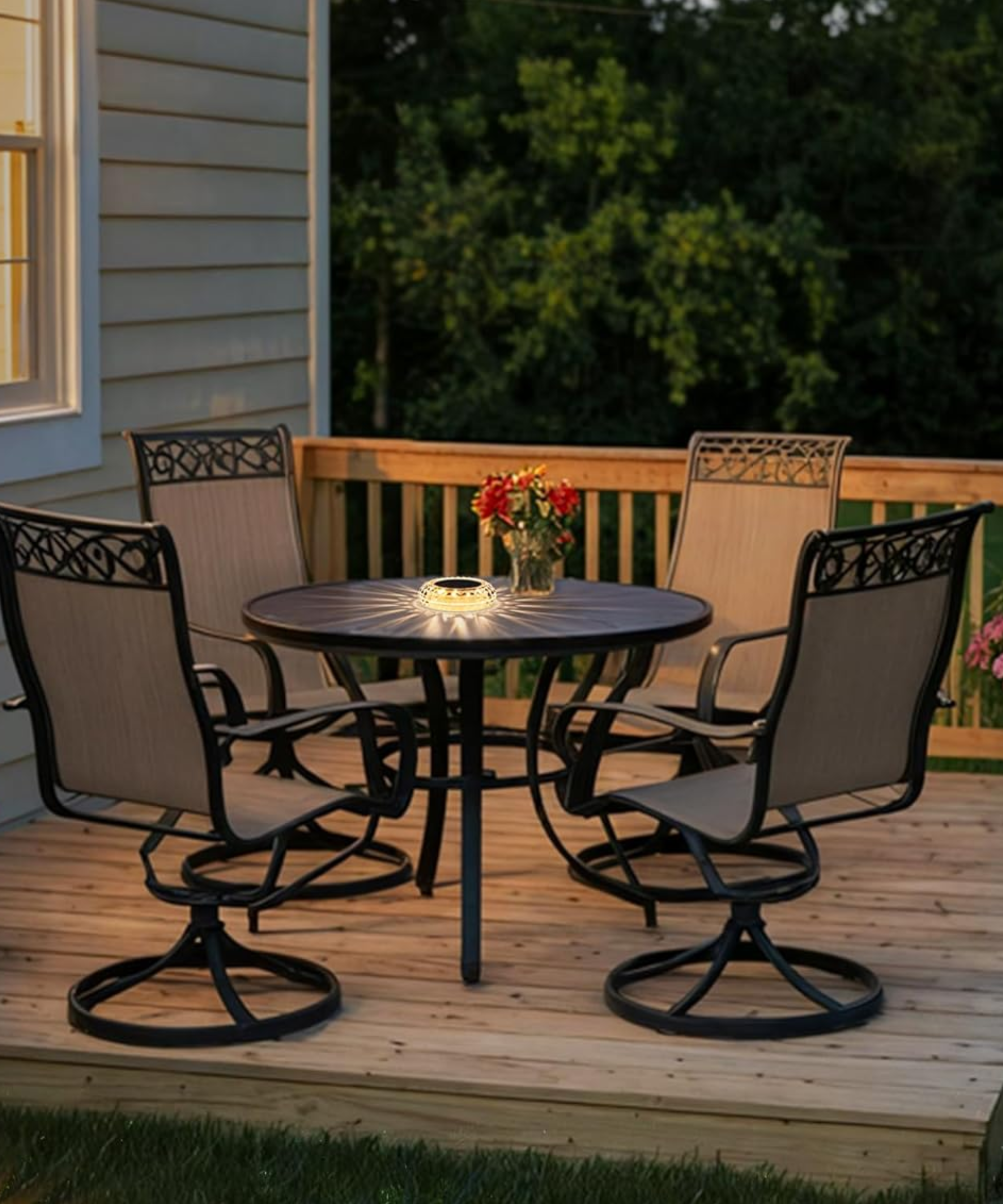 a table set with a flower vase and a disk lamp