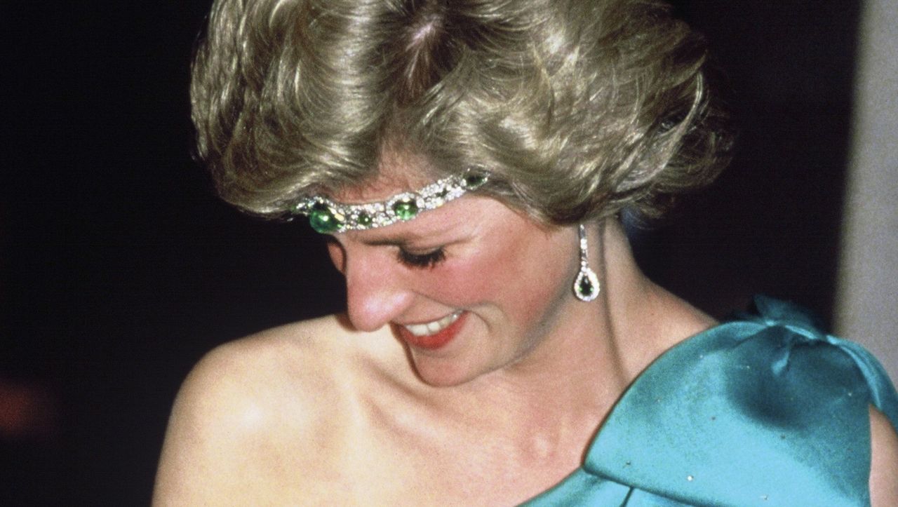 melbourne, australia october 31 diana, princess of wales, wearing a green satin evening dress designed by david and elizabeth emanuel and an emerald necklace as a headband, attends a gala dinner dance at the southern cross hotel on october 31, 1985 in melbourne, australiaphoto by anwar husseingetty images