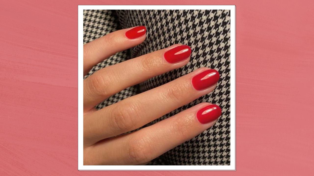 A close up of a hand with red almond nails by nail artist @matejanova/ Mateja Novakovic / in a red-pink template