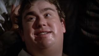John Candy wearing a weary smile in The Great Outdoors.