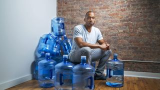 Water, Blue, Cobalt blue, Bottled water, Sitting, Drinking water, Floor, Drink, Flooring, Bottle,