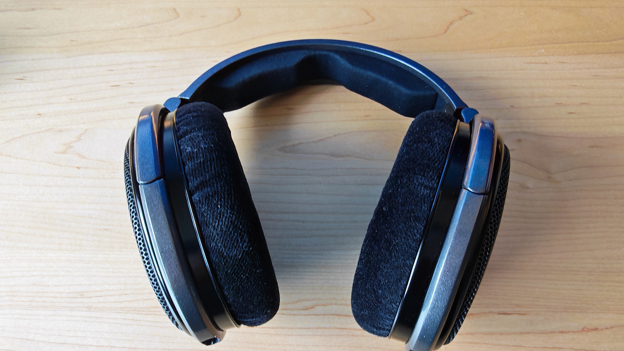 A selection of photos of the HD 650 headphones in a home office.