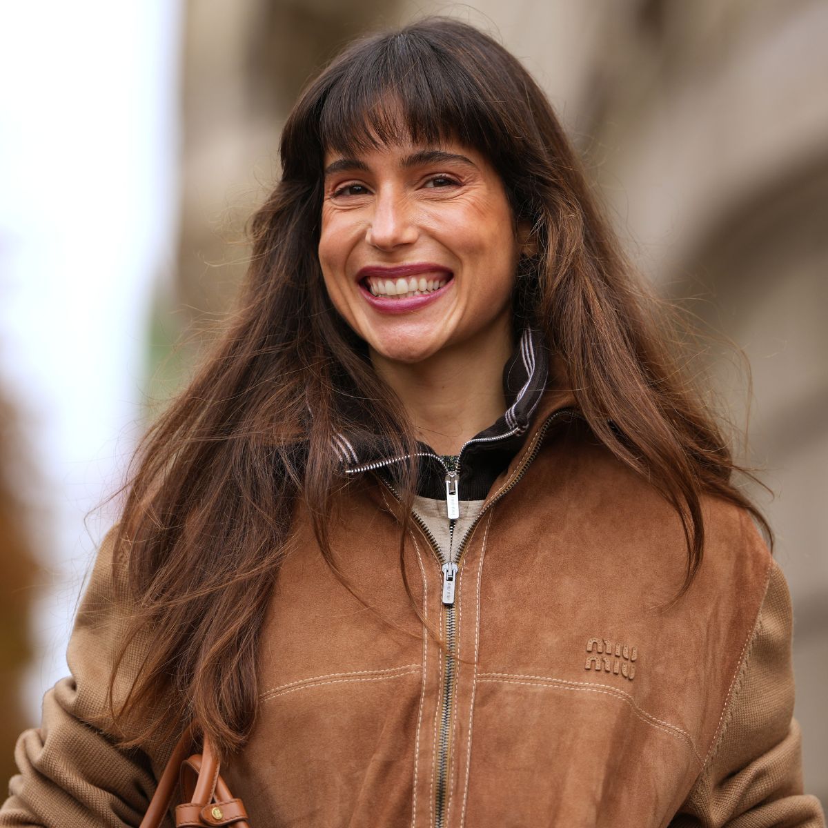 brunette woman with bouncy blow dry