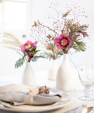 Christmas table decor with pink flower posys