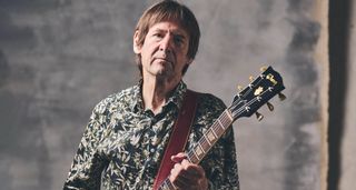 Dave Gregory is pictured with his Gibson SG