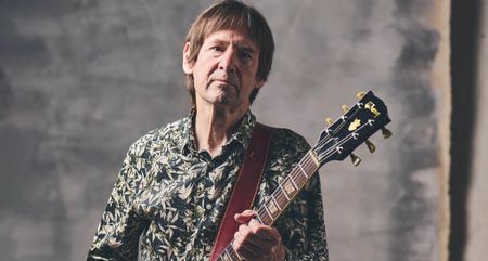 Dave Gregory is pictured with his Gibson SG