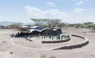 Aerial view of the vaccination centre made from corrugated metal and scaffolding