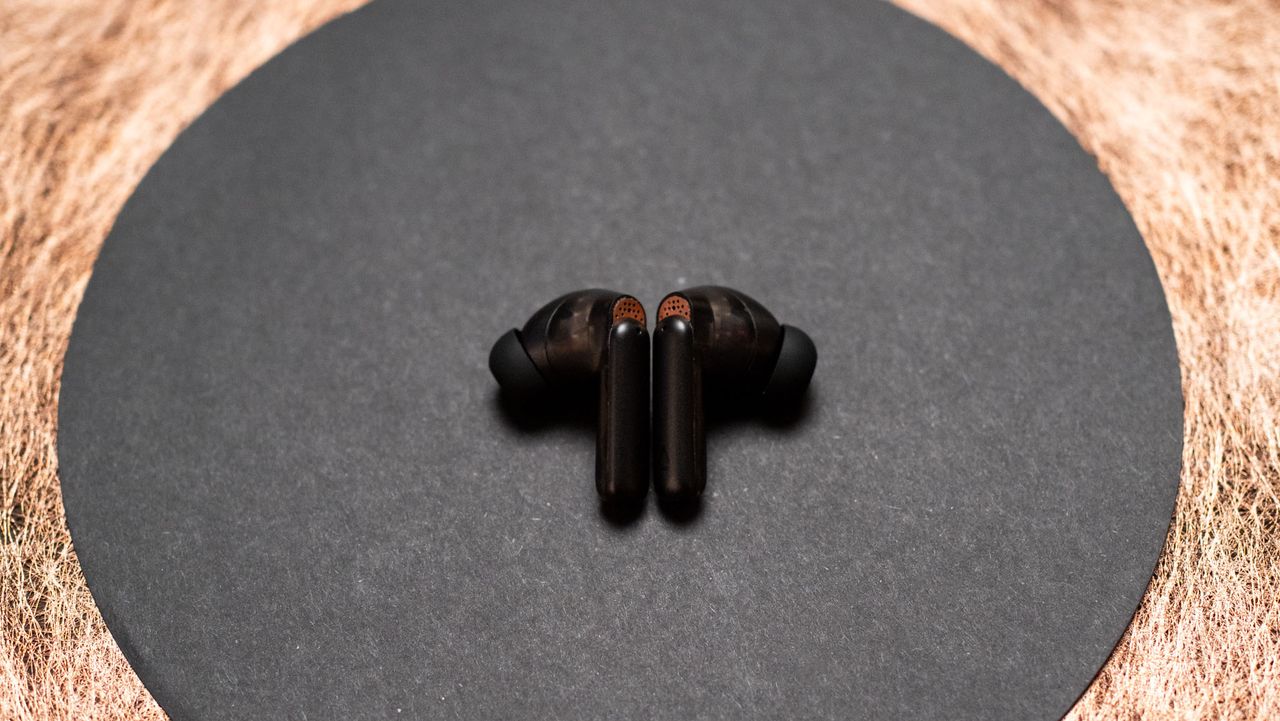 Creative Aurvana Ace 2 earbuds next to each other