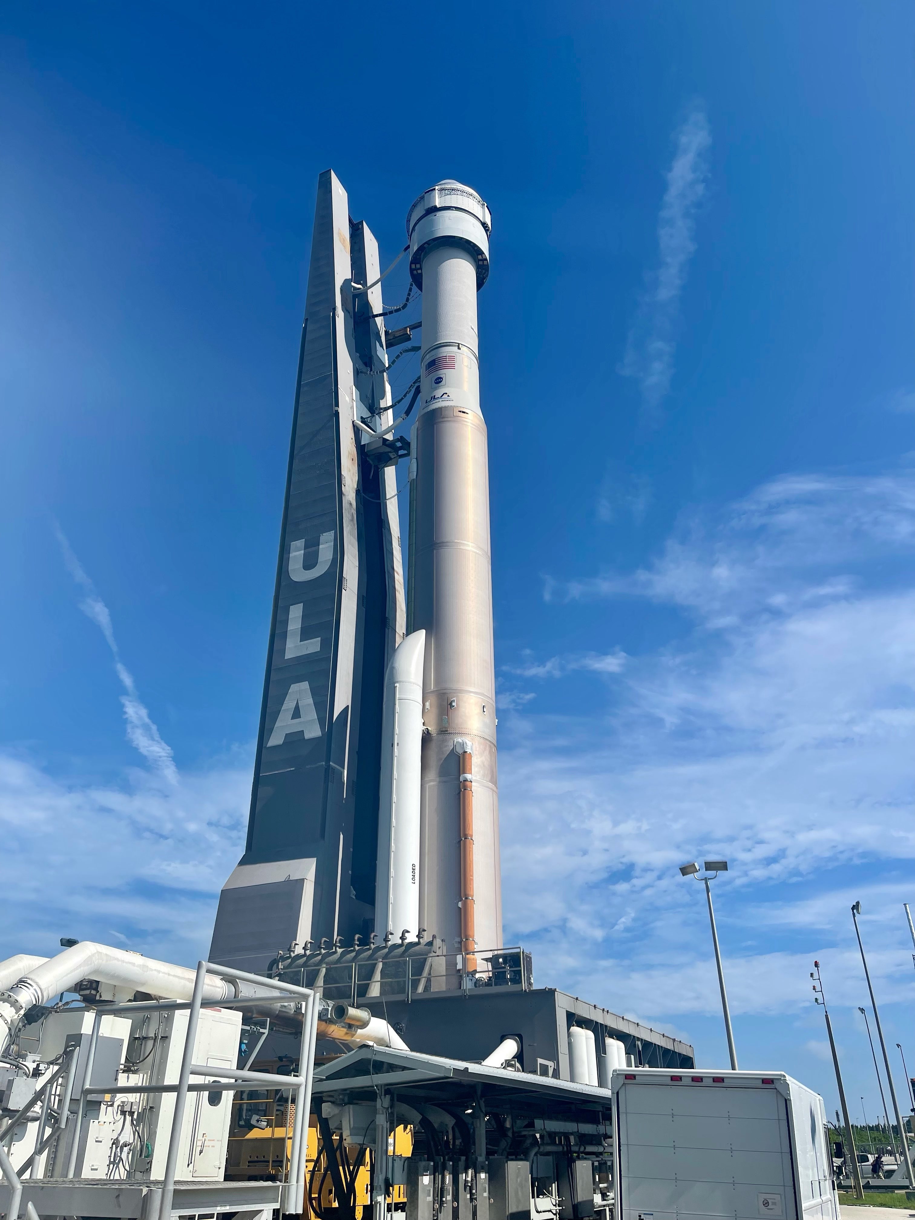 ULA's Atlas V rocket and Starliner roll out to the launch pad.