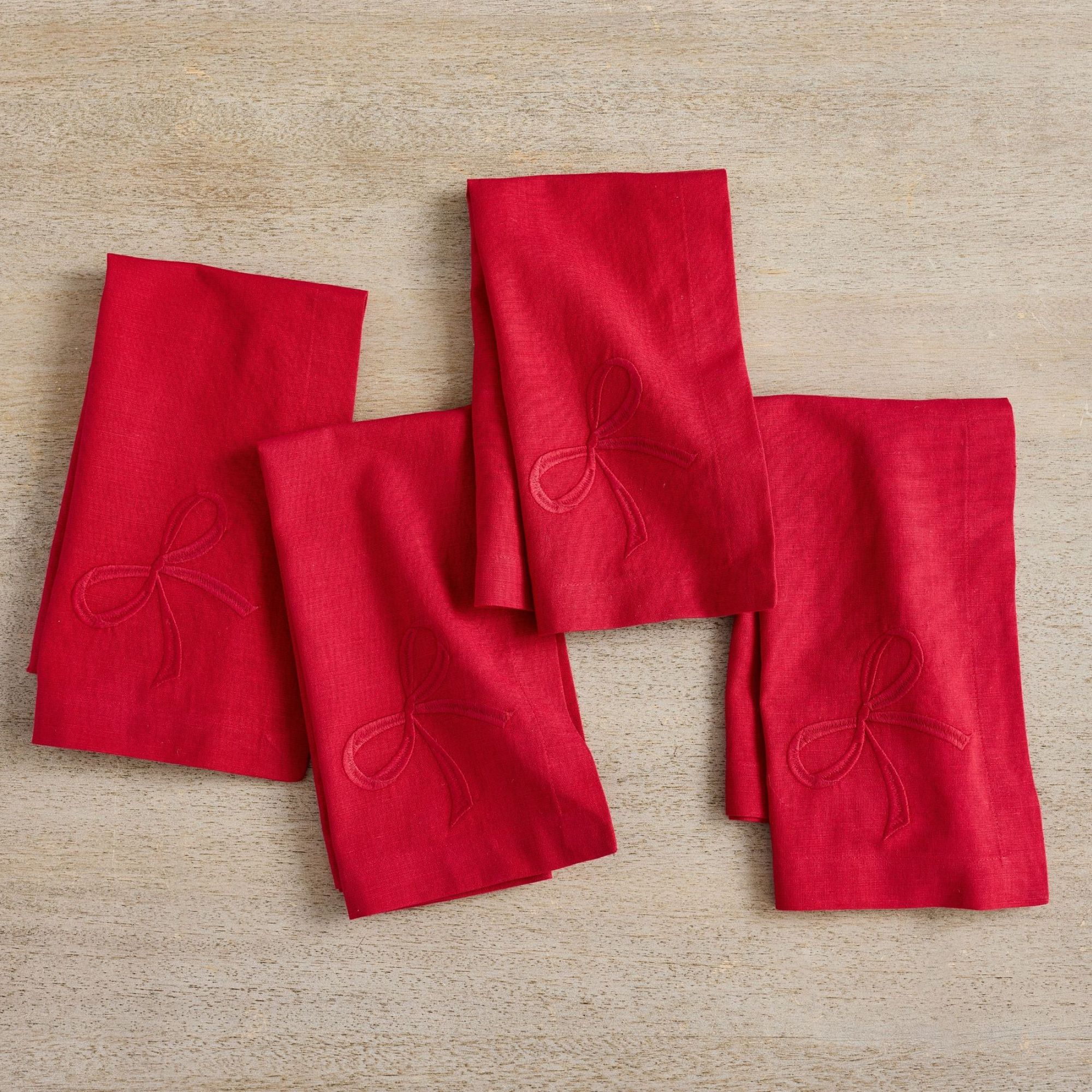 Red napkins with embroidered bow detail