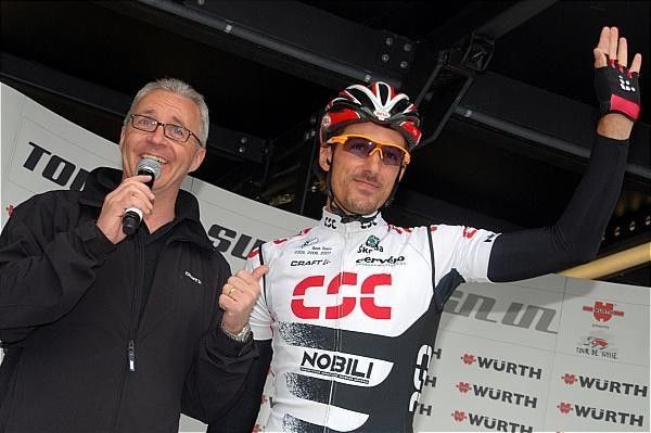 Swiss Fabian Cancellara (Team CSC) waves to the crowd at the start.