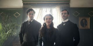 Millie Bobby Brown as Enola Holmes in the titular movie, _Enola Holmes,_ with Henry Cavill and Sam Claflin.