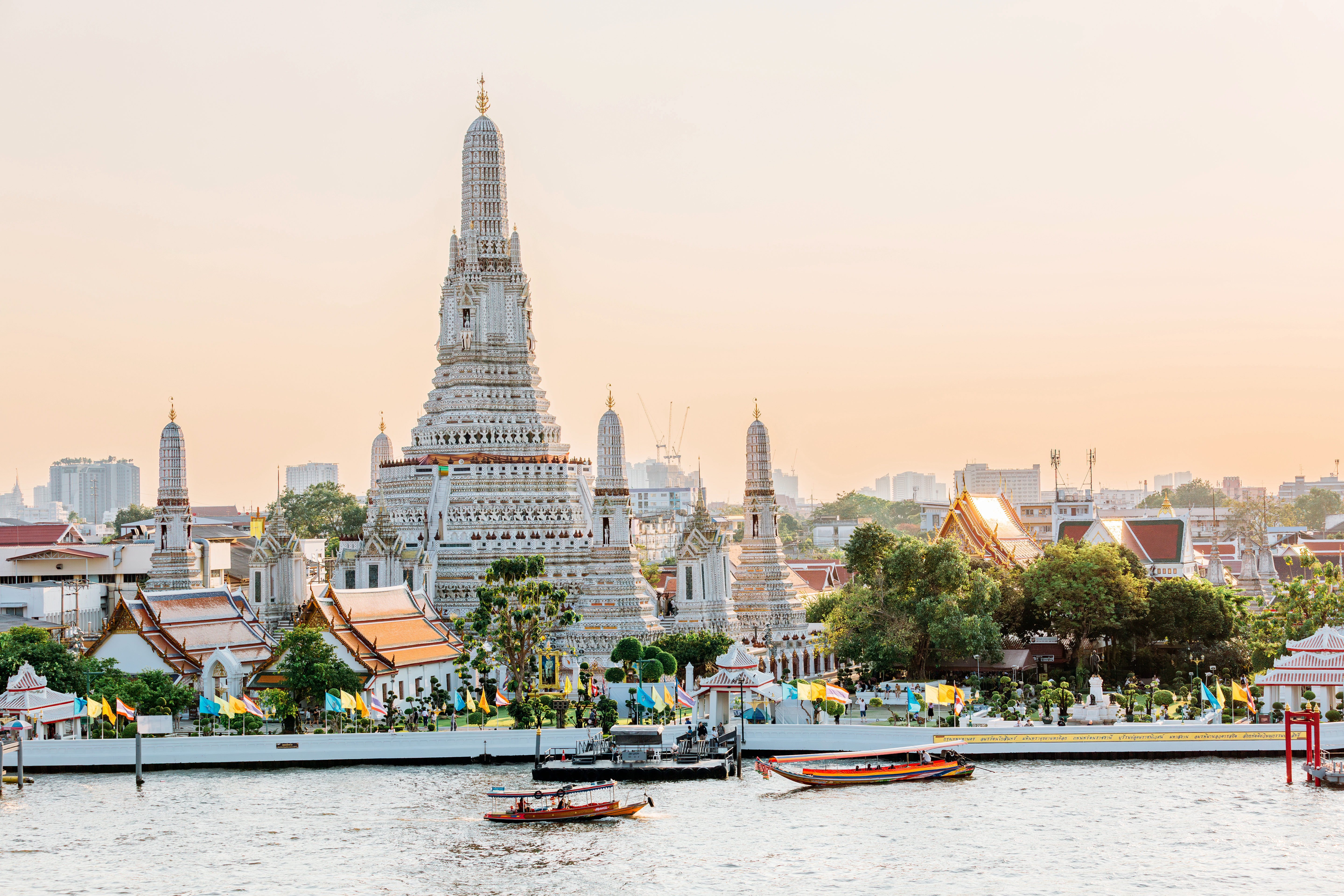 Wat Arun Buddhist temple and Chao Phraya river on a sunny day, Bangkok, Thailand