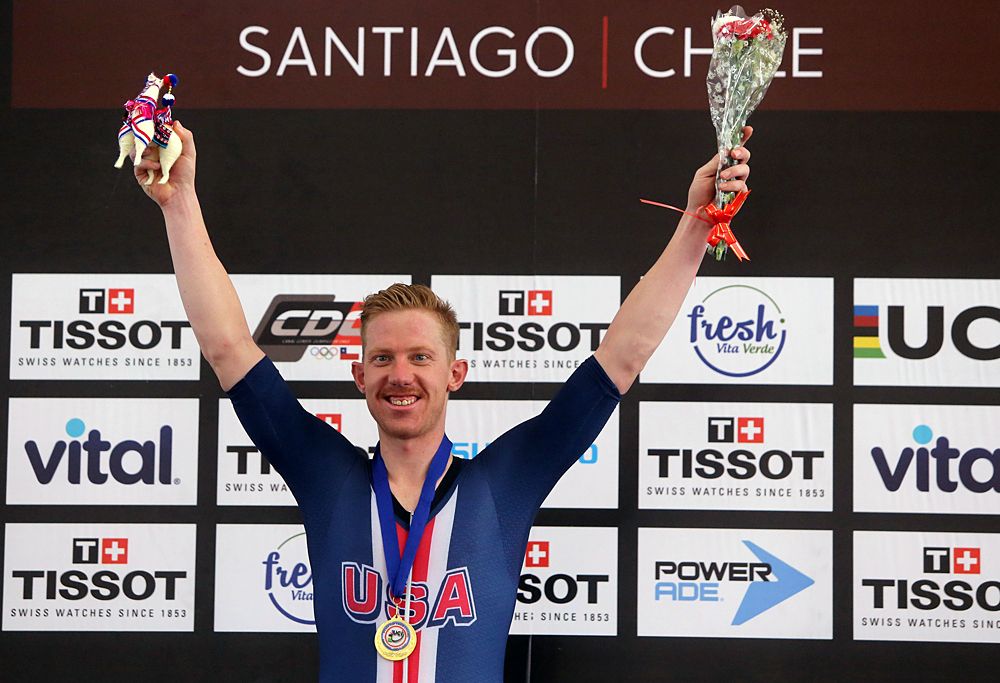 US cyclist Daniel Holloway celebrates on the podium after winning the men's Omnium race, during the Tissot UCI Track Cycling World Cup