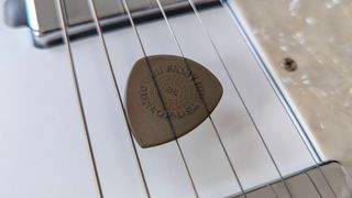 Closeup of a Dunlop Flow guitar pick