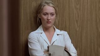 Meryl Streep, wearing a white shirt as Johanna Kramer, announces she's leaving her husband