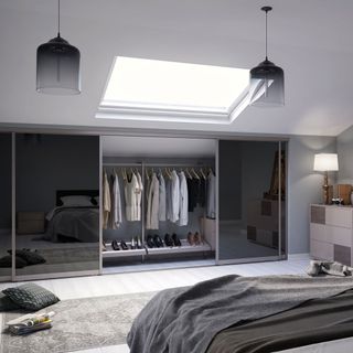 attic bedroom with sliding glass door and wooden floor