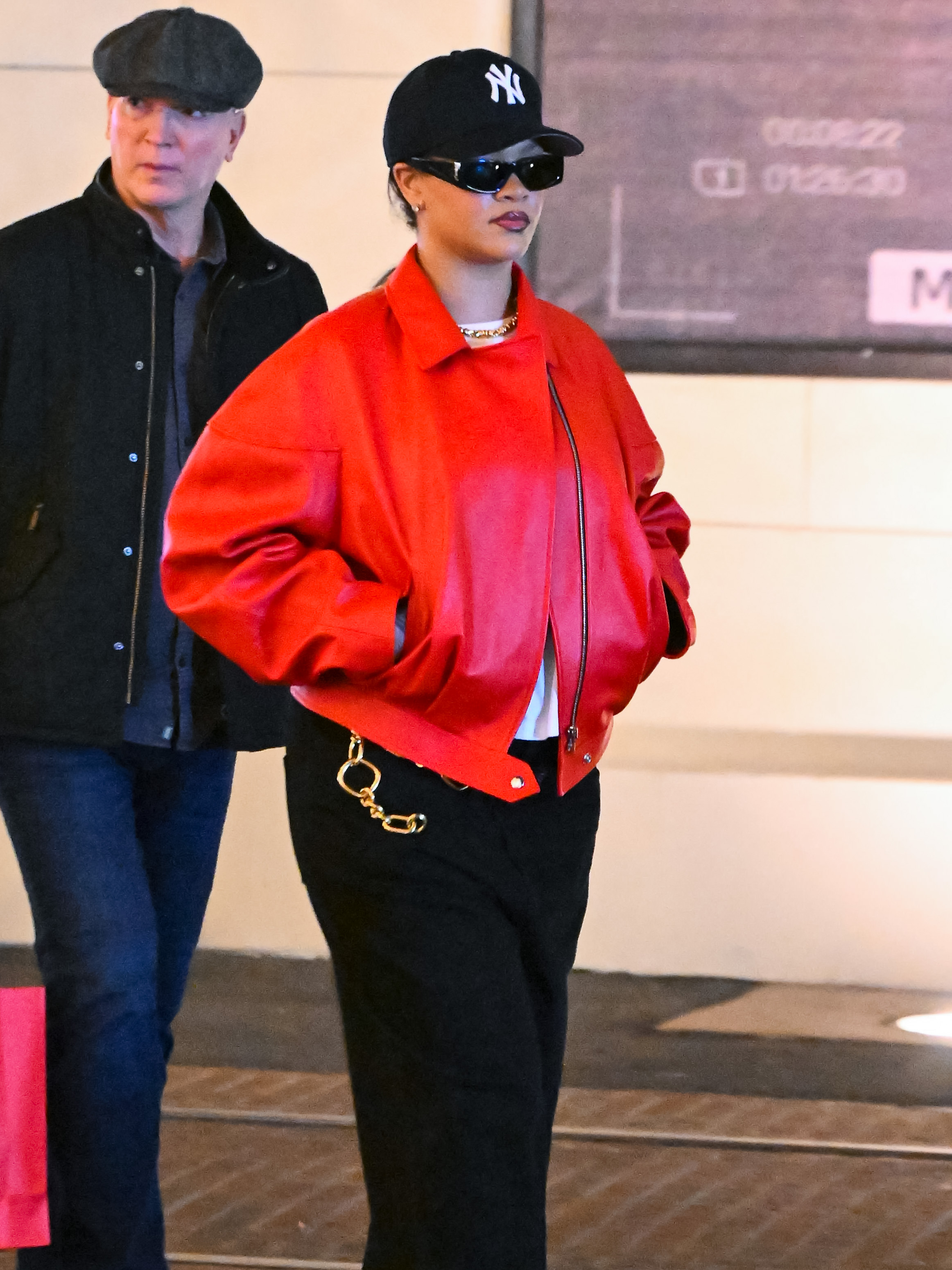 Rihanna ran errands in L.A. while wearing a red leather bomber jacket and python pumps