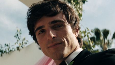 Nate Jacobs looking down at Cassie on their wedding in Euphoria.