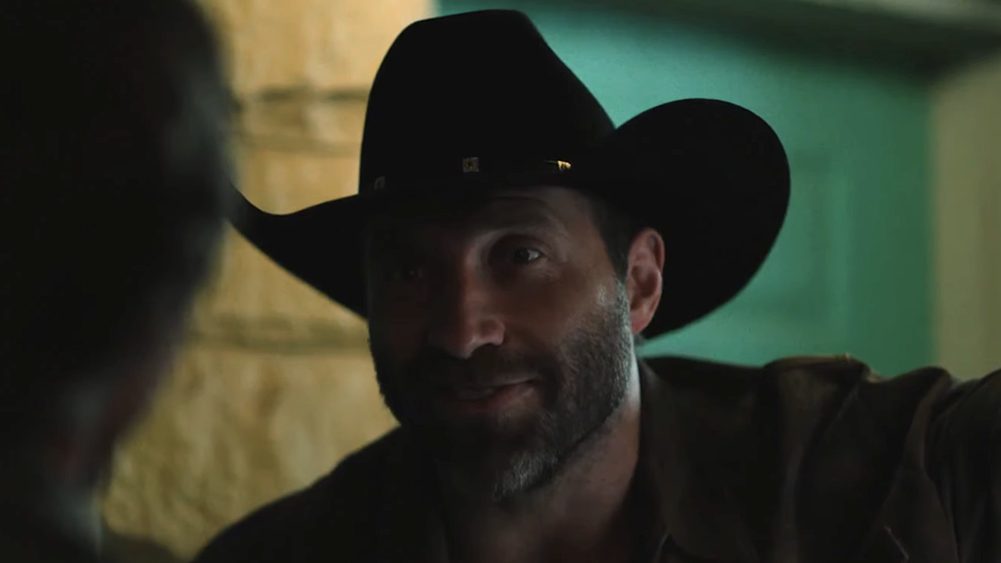 Rob-Will smiling standing outside hotel room in Dutton Ranch Episode 105