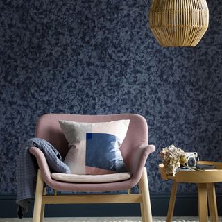 living room with blue wall and chair