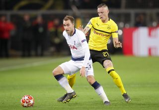 Christian Eriksen, left, in action against Borussia Dortmund